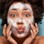 A woman with face cleanser
