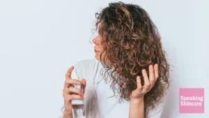 A woman using a hair product