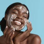 A woman using moisturiser