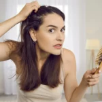 A woman alarmed with her hair