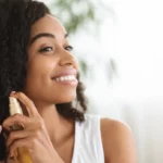 A woman using hair oil