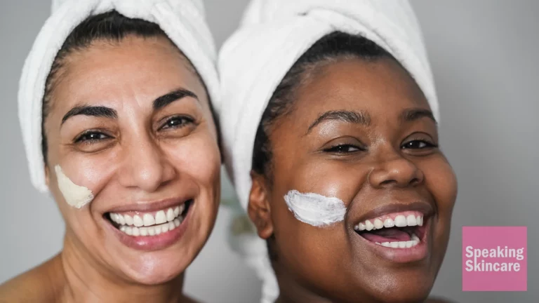 Two women using face cream