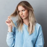 A woman looking at her bad hair