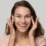 A woman using eye cream