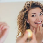 A woman using lip product