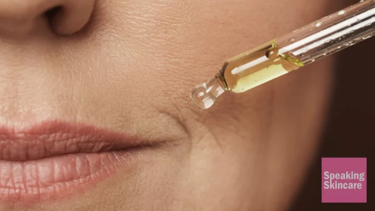 An older woman using serum.
