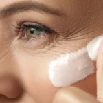 A woman using eye cream