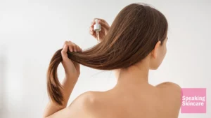 A woman using hair serum