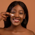 A woman using eye cream