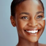 A woman using a serum