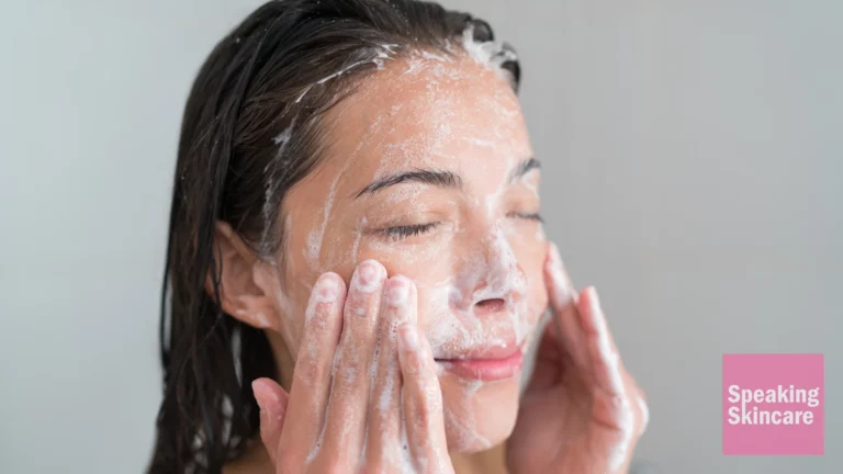 A woman using a face cleanser