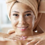 A woman using face wash