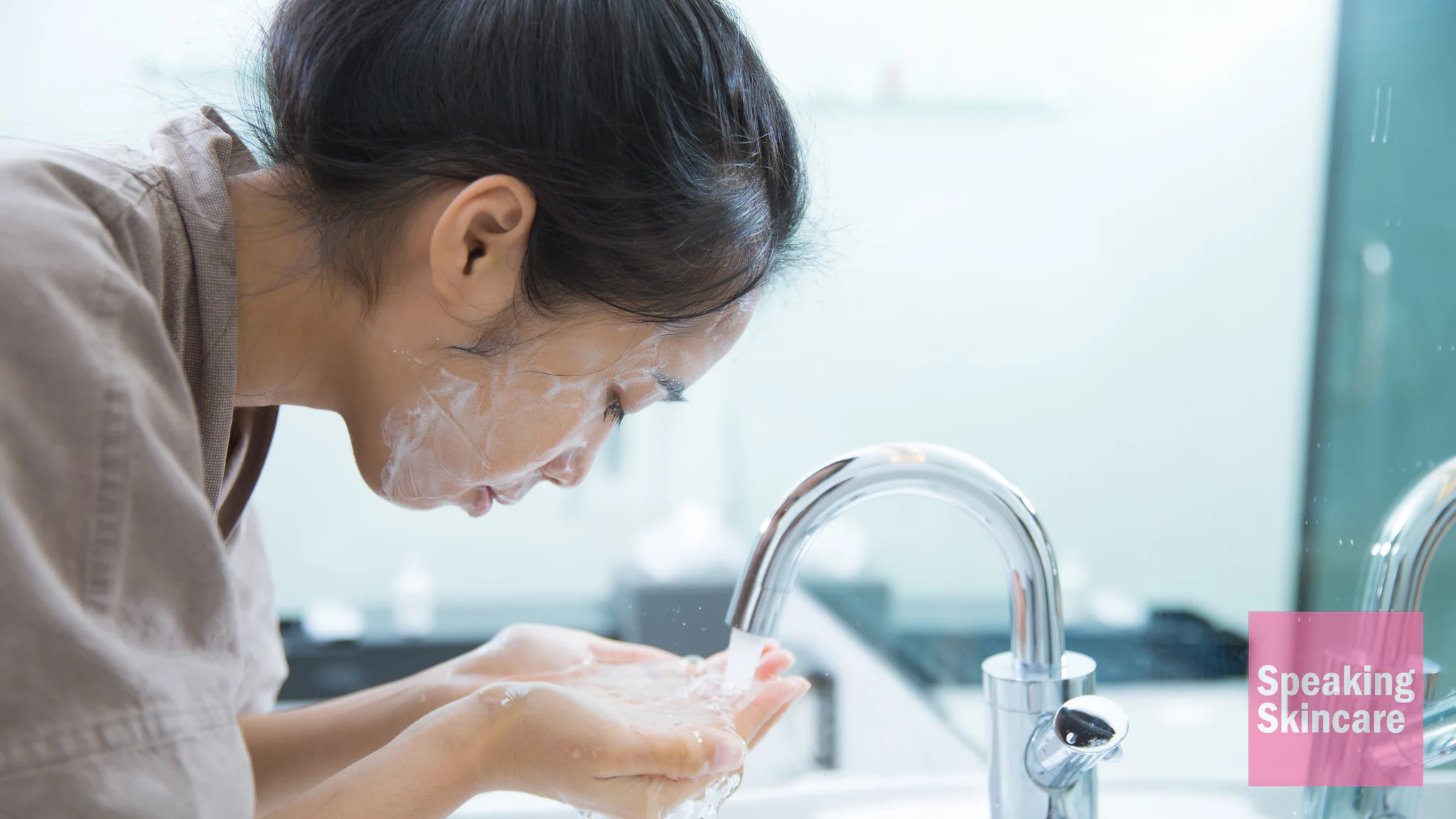 A woman washing her face