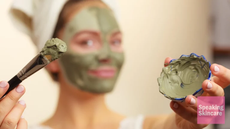 A woman wearing a clay mask