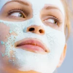 A woman in a dry clay mask
