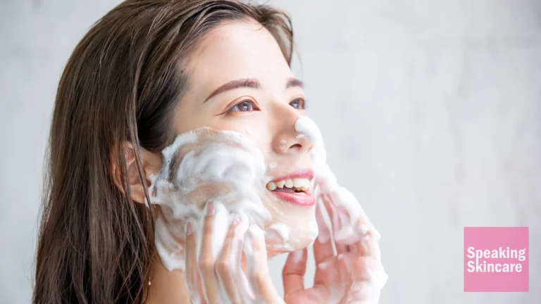 A woman washing her face