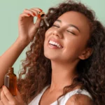 A woman using face serum