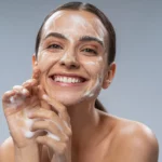 A woman washing her face