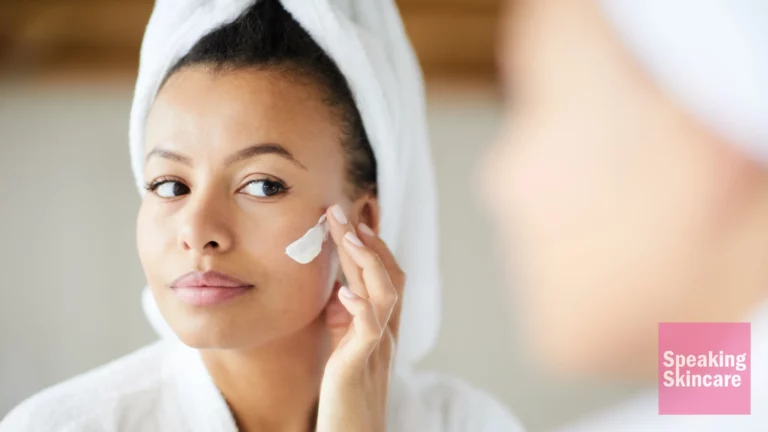 A woman using product on face