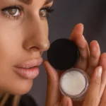A woman holding a product