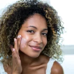 A woman using a face cream