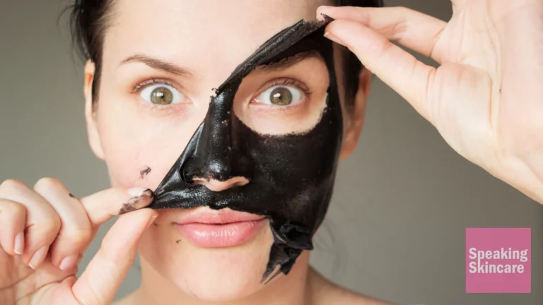 Woman peeling off mask