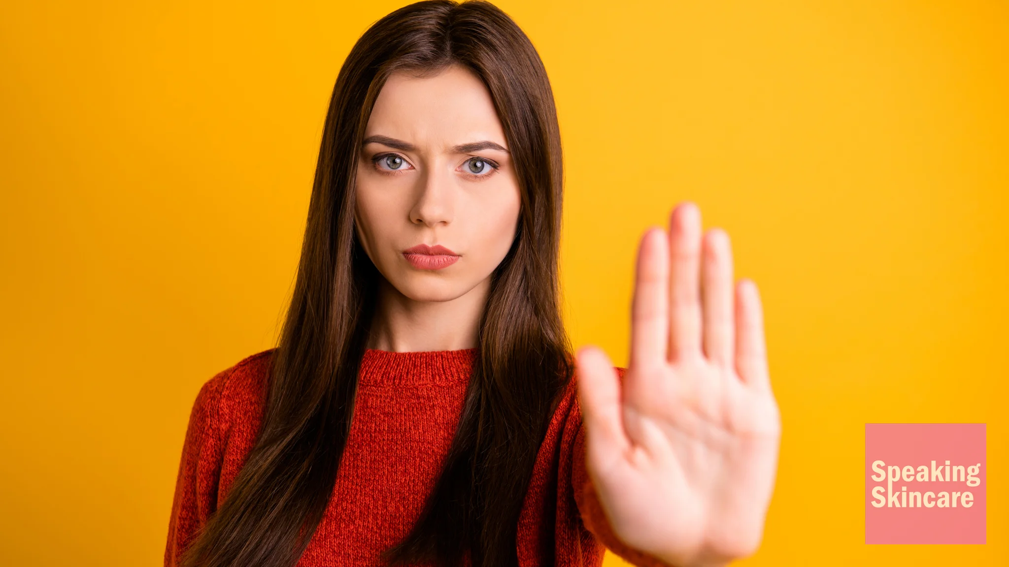 A woman holding up her hand