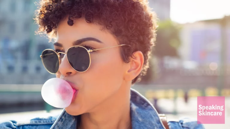 A woman blowing gum