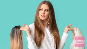 A woman holding wigs