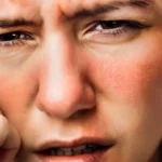 A woman with red cheeks