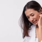 A woman with an itchy face