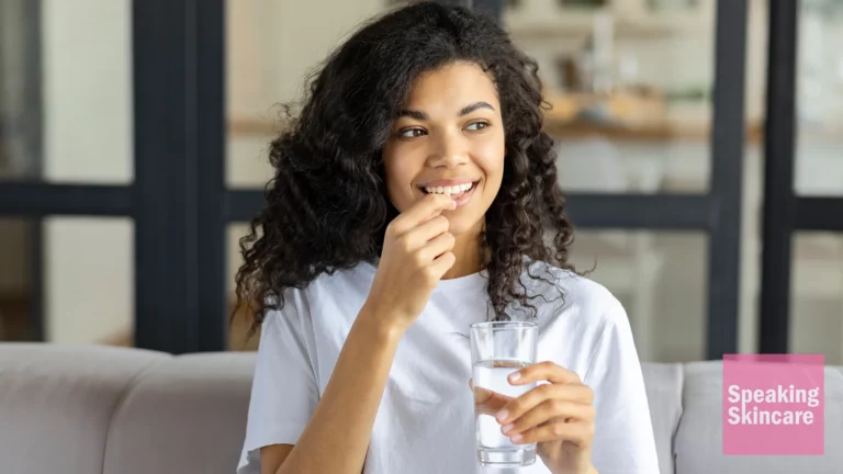 A woman taking a vitamin