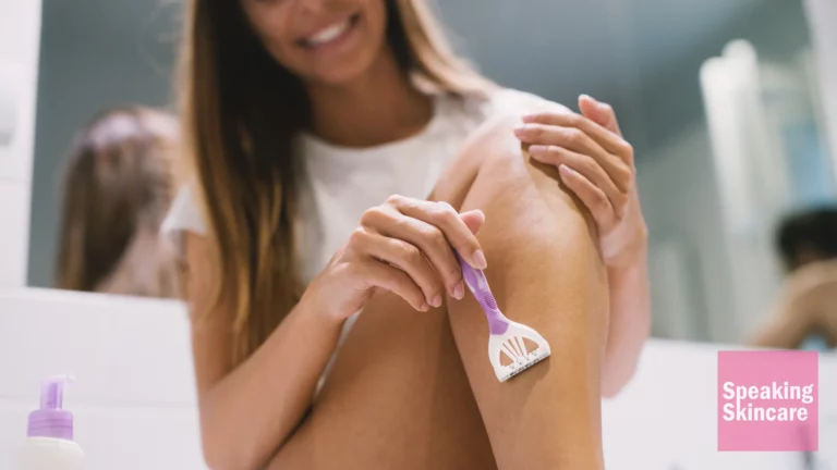 Woman shaving her legs