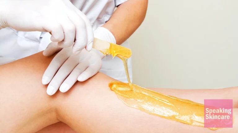 A woman getting her leg waxed