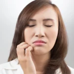 A woman looking uncomfortable