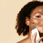 A woman using skin scrubber