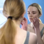 A girl looking in the mirror